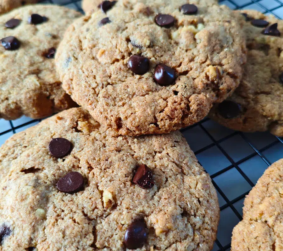 big chocolate chip and nut cookies on a wire rack