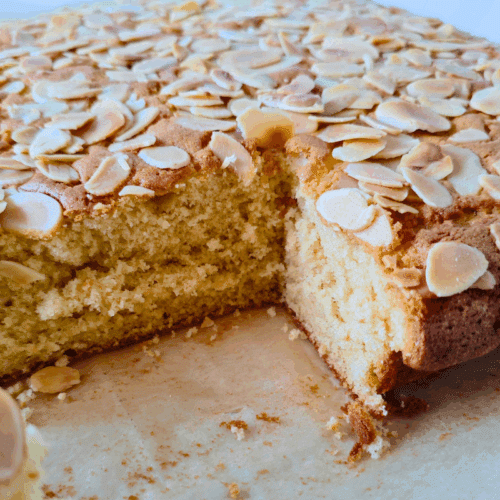 ginger cake traybake topped with flaked almonds