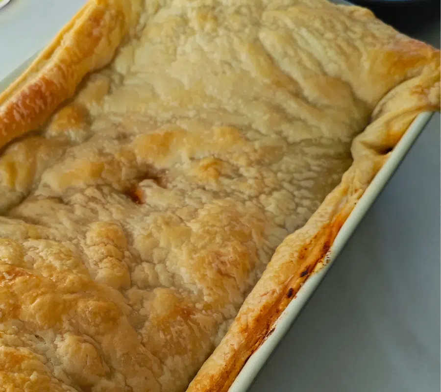 puff pastry pot pie with a sausage and butter bean filling