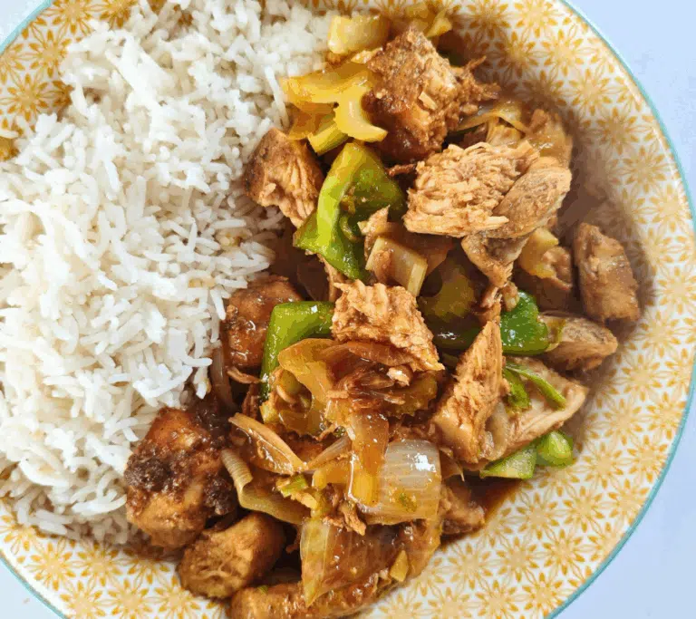 air fryer bits of chicken with green pepper in a oyster sauce with a side of basmati rice in a poke bowl