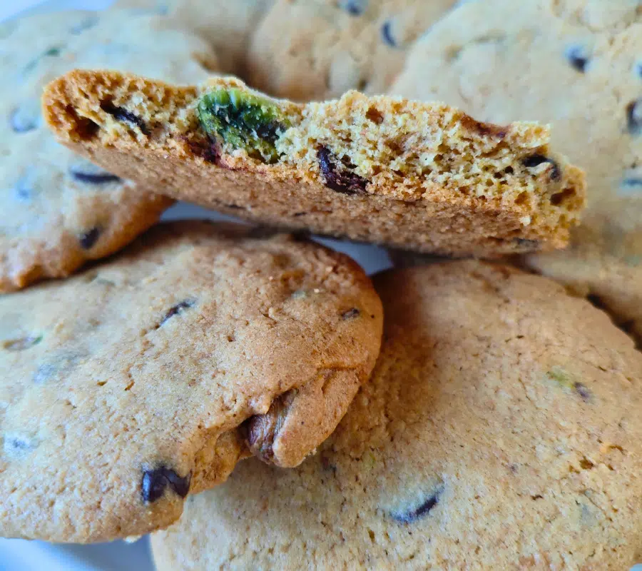 a pile of pistachio and chocolate chip cookies on a plate