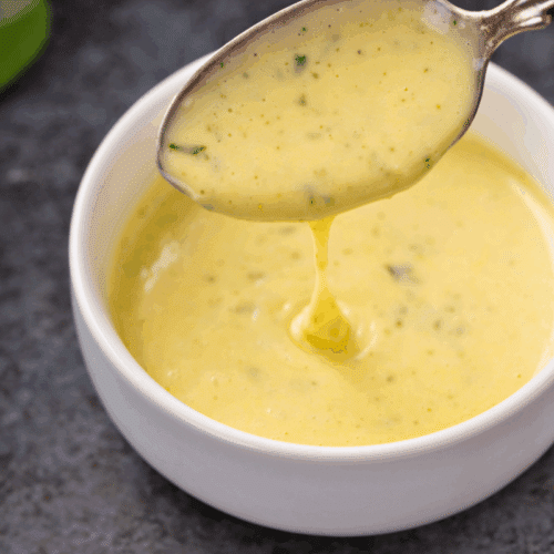 diary-free bearnaise sauce in a white bowl