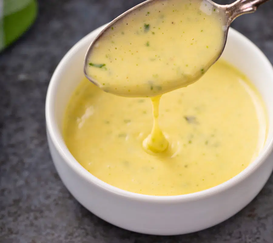 diary-free bearnaise sauce in a white bowl