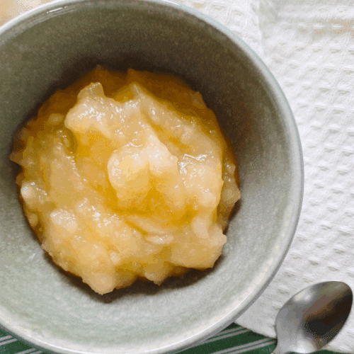 homemade stewed apples in a green bowl