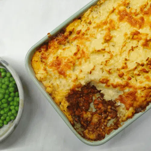 shepherds pie in a oven proof dish on a white surface