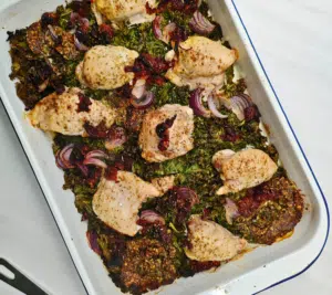 chicken thighs, kale, pesto in a traybake tin