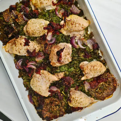 chicken thighs, kale, pesto in a traybake tin