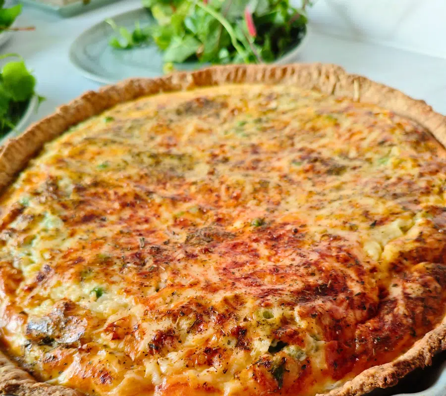 a large pea and bacon quiche