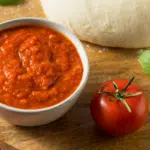 passata pizza sauce in a small white bowl