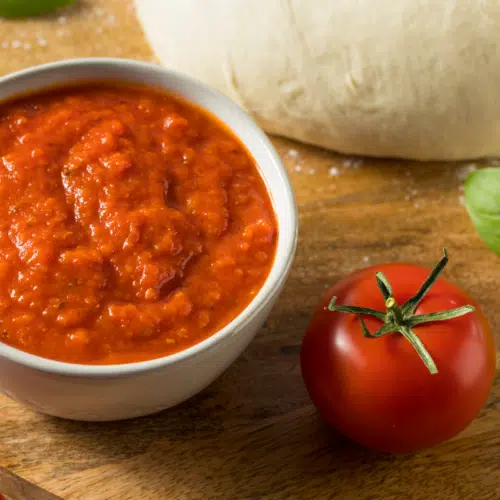 passata pizza sauce in a small white bowl
