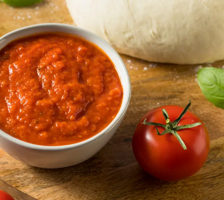 passata pizza sauce in a small white bowl