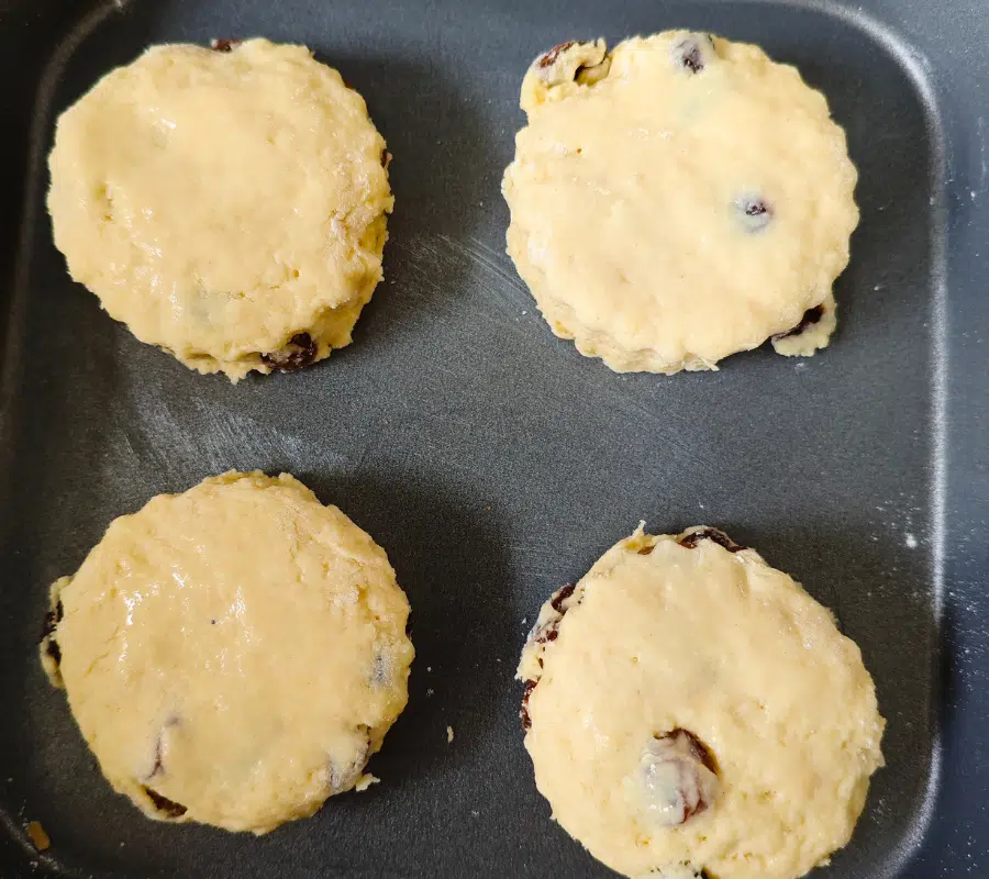 four sultana scones ready to be cooked in the air fryer