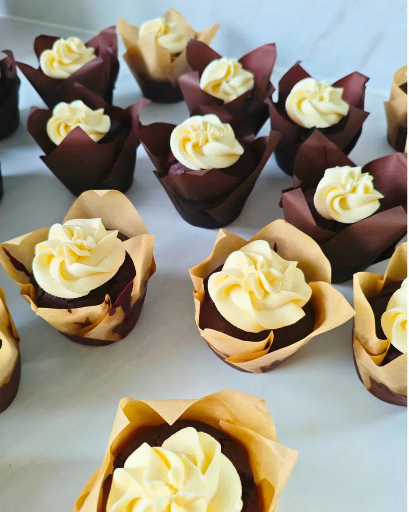 chocolate cupcakes with vanilla buttercream on top